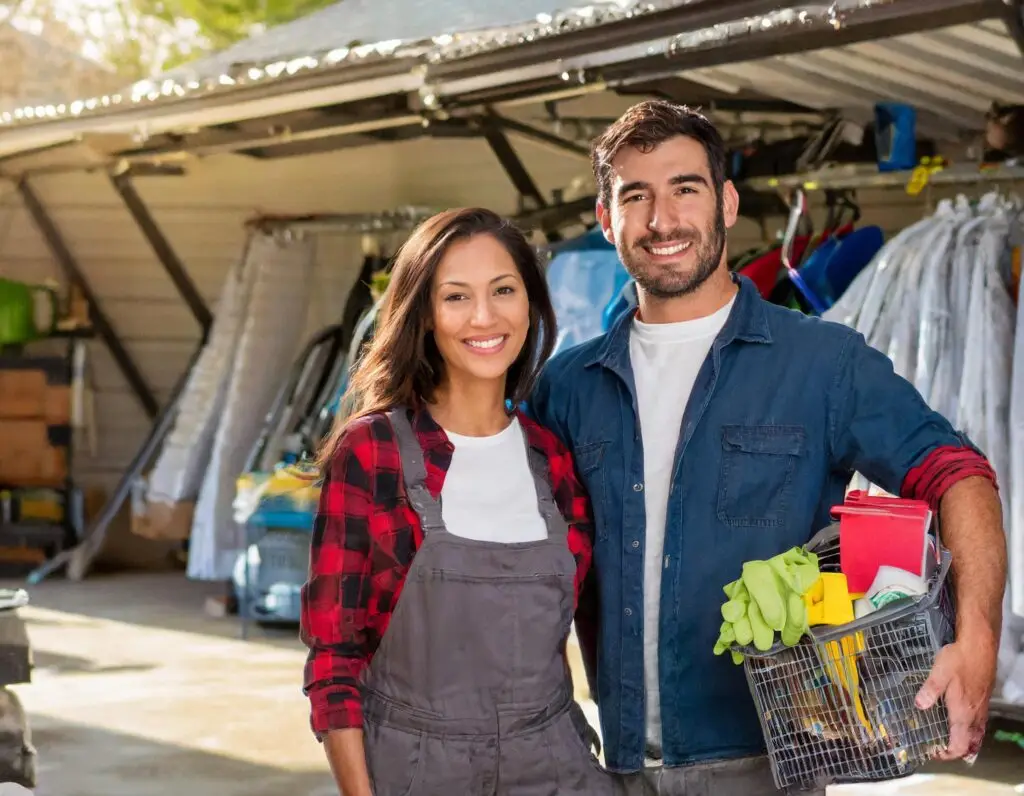 woman and man standing near a messy storage area